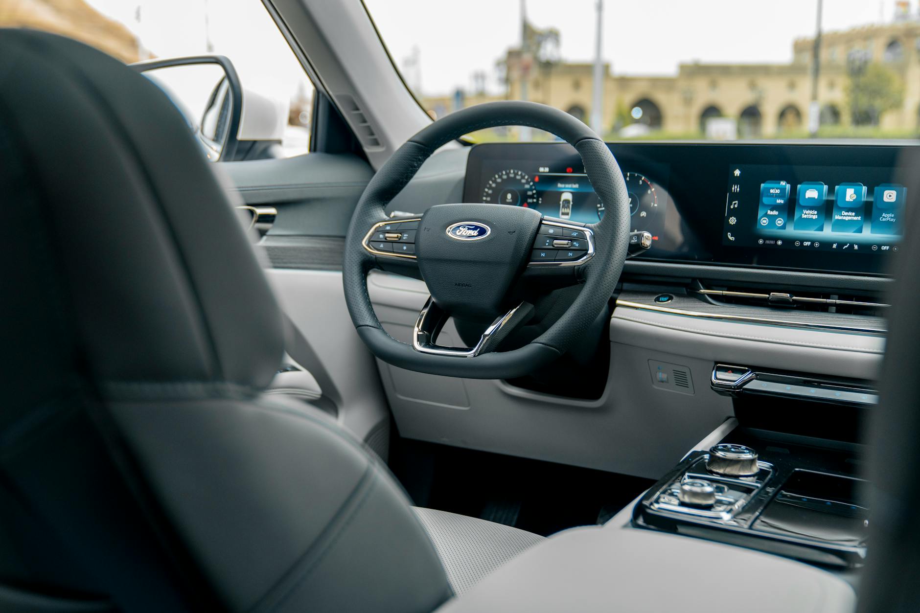 Sleek modern car interior featuring a digital dashboard and luxury design elements.