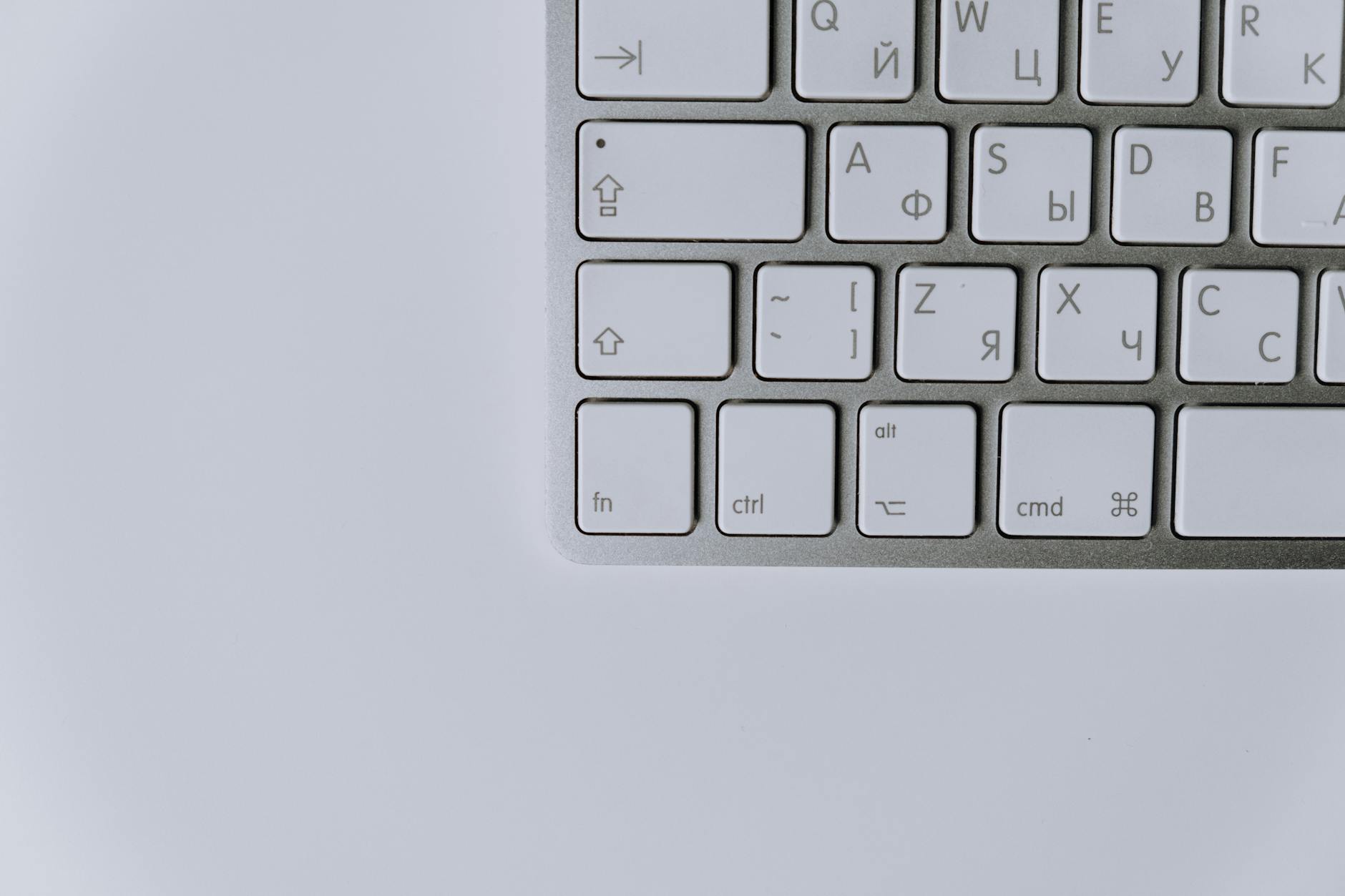 Close-up of a modern keyboard featuring Cyrillic and Latin characters, ideal for technology themes.