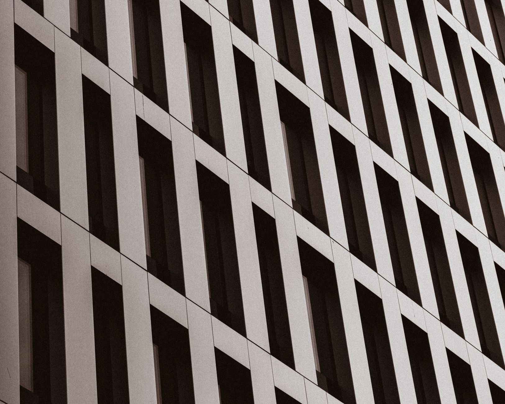 Architectural view of a modern building facade in Vienna, Austria, showcasing geometric patterns and symmetry.
